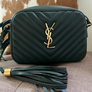 Green camera bag with crossbody functionality